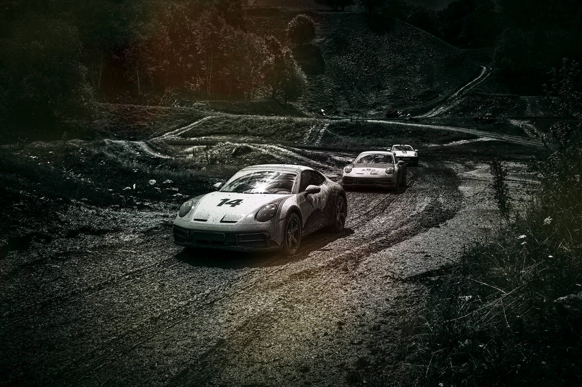 3 Porsche 911 Dakar on a muddy trip