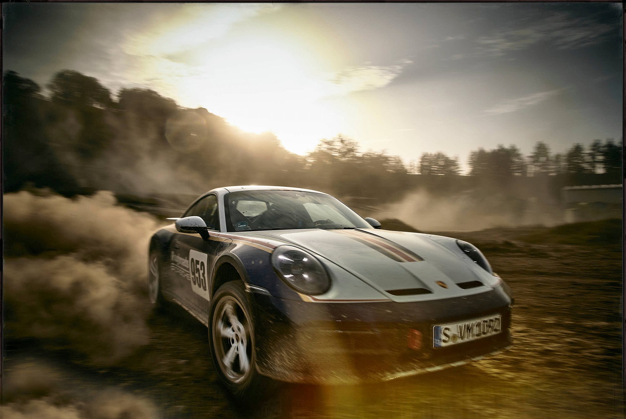 Fine art photo by Frank Kayser – Porsche Dakar in close-up, drifting at full speed with dust clouds around.