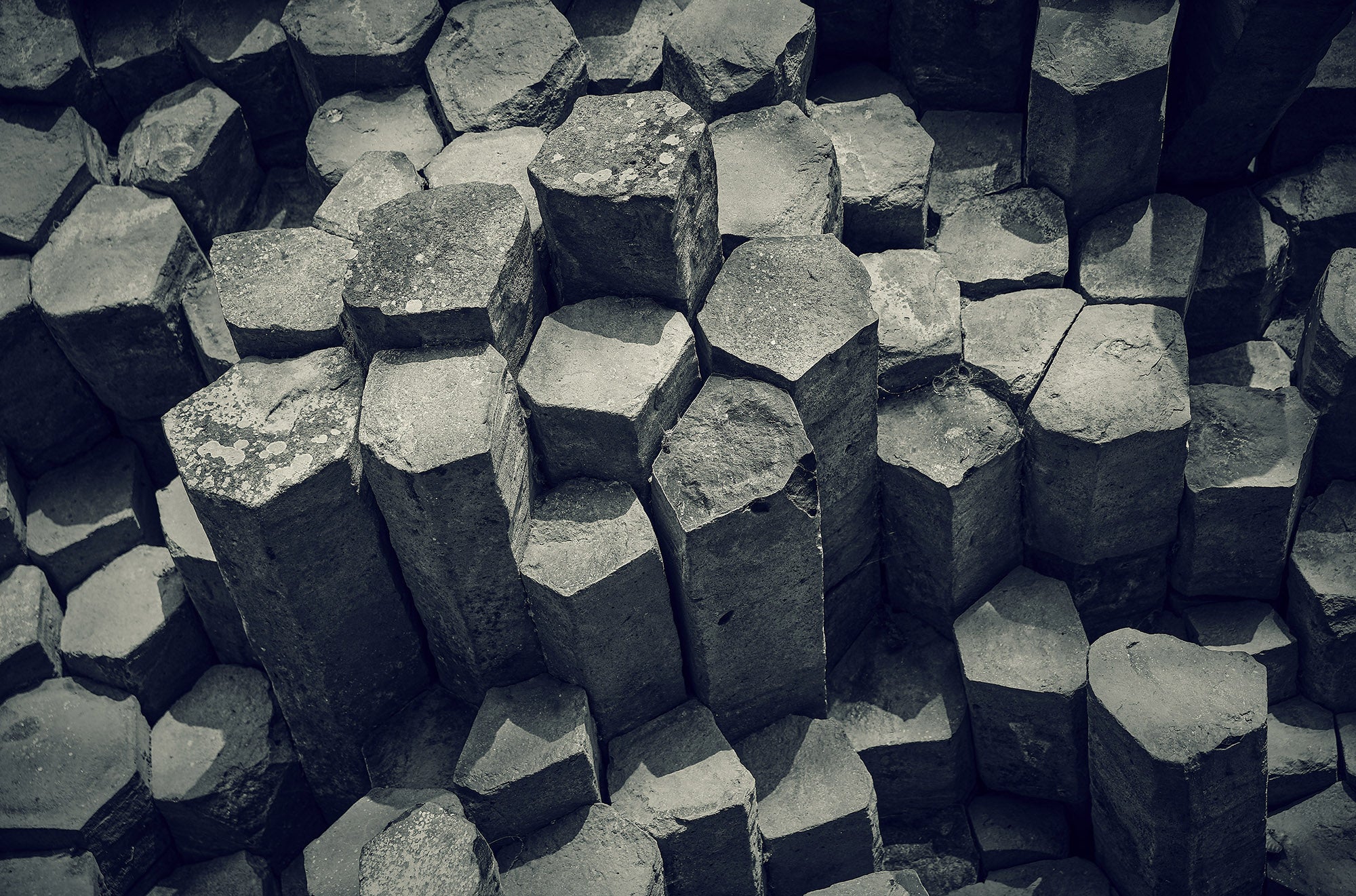 Fine art photography by Frank Kayser – basalt columns forming geometric patterns shaped by volcanic forces.