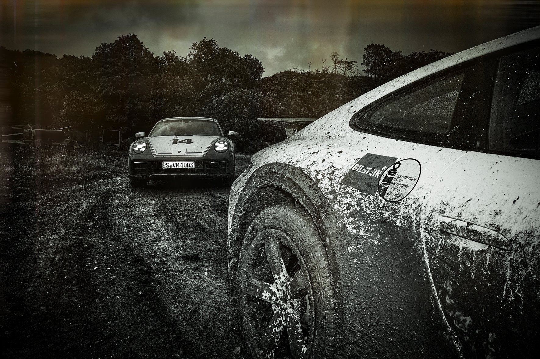 two Porsche Dakars on a muddy trip