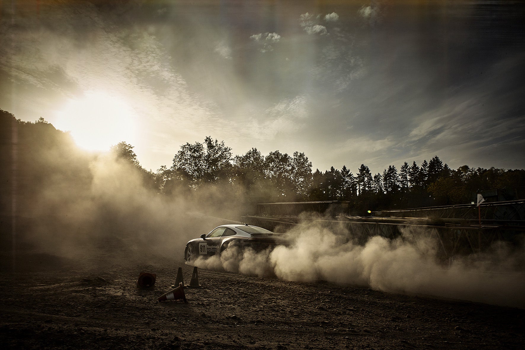 Dakar 911 drivfting into evening sun
