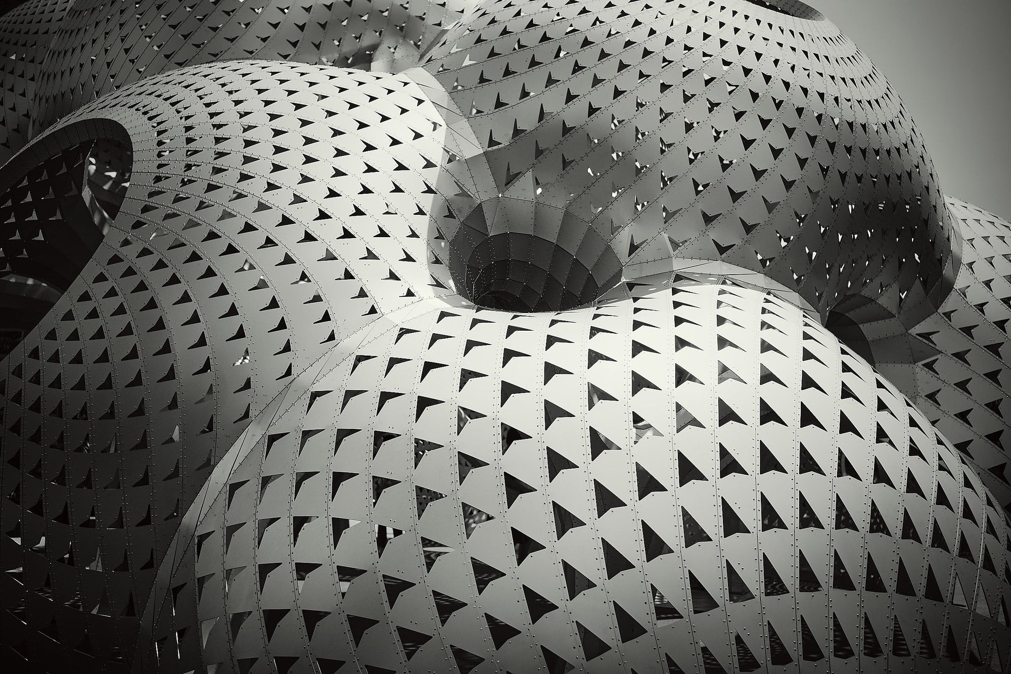 Fine art photography print by Frank Kayser – close-up view of futuristic dome architecture with perforated triangular patterns, geometric detail shot, limited edition wall art.