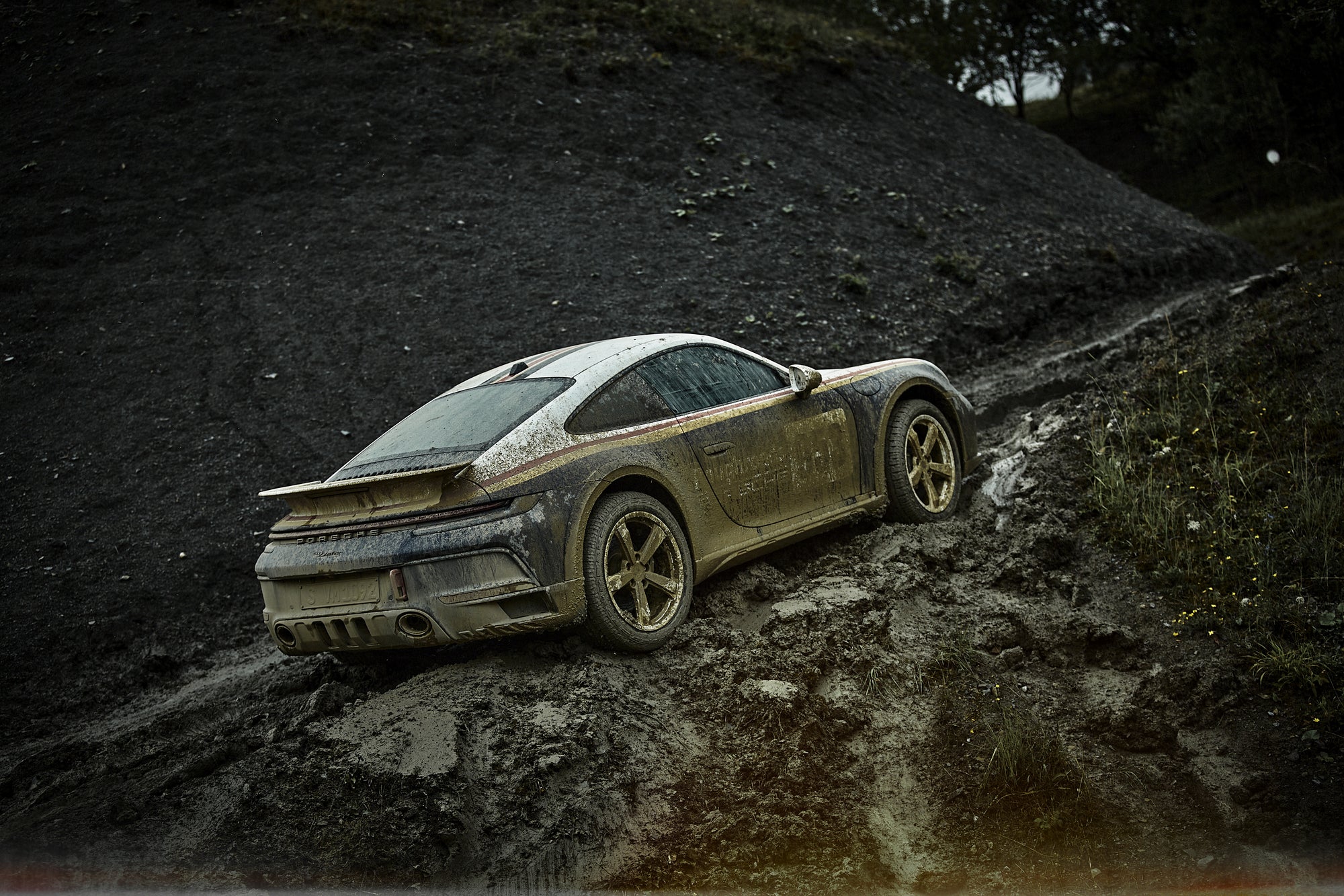 car uphill in deep mudd